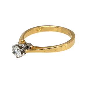 Preowned 18ct Yellow and White Gold & Diamond Set Solitaire Ring in size L with the weight 2.40 grams. The Diamond is approximately 25pt with clarity Si1 and colour K - M