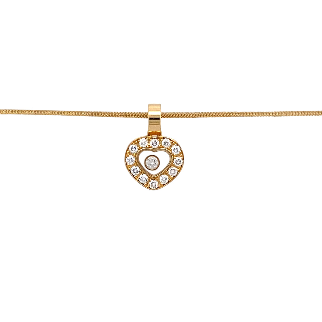 Preowned 18ct Yellow Gold & Diamond Set Pendant with a diamond encased inside the heart on an 18" snake chain. The necklace has the weight 5.70 grams and there is approximately 15pt of diamond content in total. The pendant is 15mm long including the bail and the pendant is signed Chopard (the chain is not Chopard)
