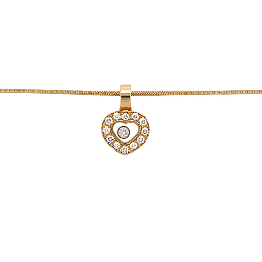 Preowned 18ct Yellow Gold & Diamond Set Pendant with a diamond encased inside the heart on an 18" snake chain. The necklace has the weight 5.70 grams and there is approximately 15pt of diamond content in total. The pendant is 15mm long including the bail and the pendant is signed Chopard (the chain is not Chopard)