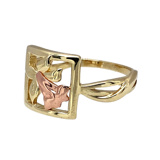 Bring Welsh heritage and graceful detail to your jewellery collection with this pre-owned 9ct yellow and rose gold Clogau daffodil ring — a beautifully symbolic piece inspired by the national flower of Wales.

Design: The front of the ring measures 10mm high and features a delicate daffodil motif, showcasing soft petal detailing and the signature Clogau styling.
Material: Made from 9ct yellow and rose gold, the warm tones highlight the floral design and add a distinctive two-tone touch.