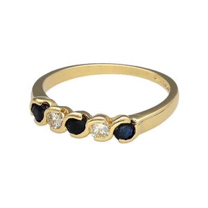 Preowned 18ct Yellow Gold Diamond & Sapphire Set Band Ring in size N with the weight 2.90 grams. There is approximately 16pt of diamond content in total with approximate clarity Si1 and colour M - R