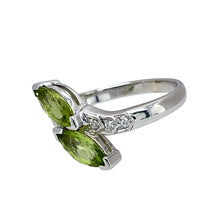 Load image into Gallery viewer, Preowned 14ct White Gold Diamond &amp; Peridot Set Wrap Around Ring in size L with the weight 3.60 grams. The peridot stones are each 8mm by 4mm
