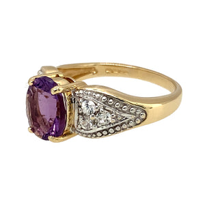 Preowned 9ct Yellow and White Gold Amethyst & Cubic Zirconia Set Dress Ring in size N with the weight 4.10 grams. The amethyst stone is 9mm by 7mm
