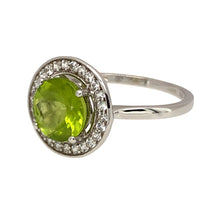 Load image into Gallery viewer, Preowned 9ct White Gold Peridot &amp; Cubic Zirconia Set Halo Ring in size N with the weight 2.30 grams. The peridot stone is 8mm diameter
