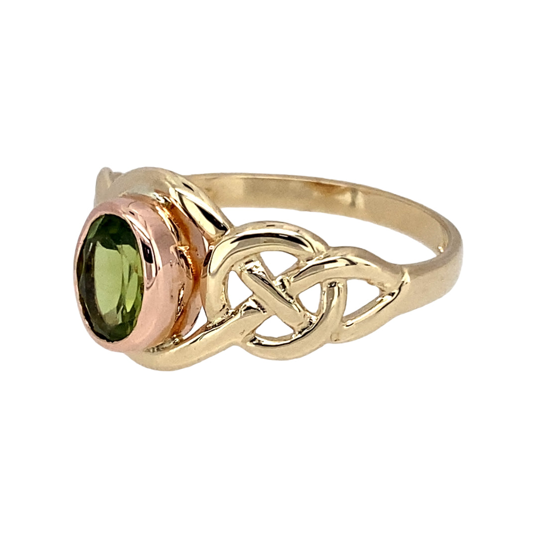 Preowned 9ct Yellow and Rose Gold & Peridot Set Clogau Celtic Birthstone Ring in size O with the weight 2.40 grams. The peridot stone is approximately 6.5mm by 4.5mm. Peridot is the birthstone for the month of August and is said to bring balance and clarity to the wearer