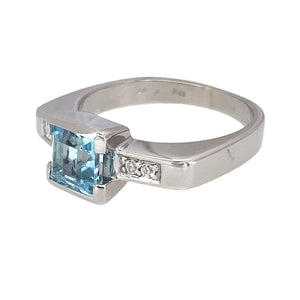 Preowned 9ct White Gold Blue Topaz & Cubic Zirconia Set Ring in size P with the weight 6.40 grams. The blue topaz stone is 6mm by 6mm