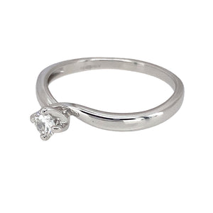 Preowned 18ct White Gold & Diamond Off Set Solitaire Ring in size N with the weight 2.30 grams. The diamond is approximately 15pt at approximate clarity Si1 and colour J - K
