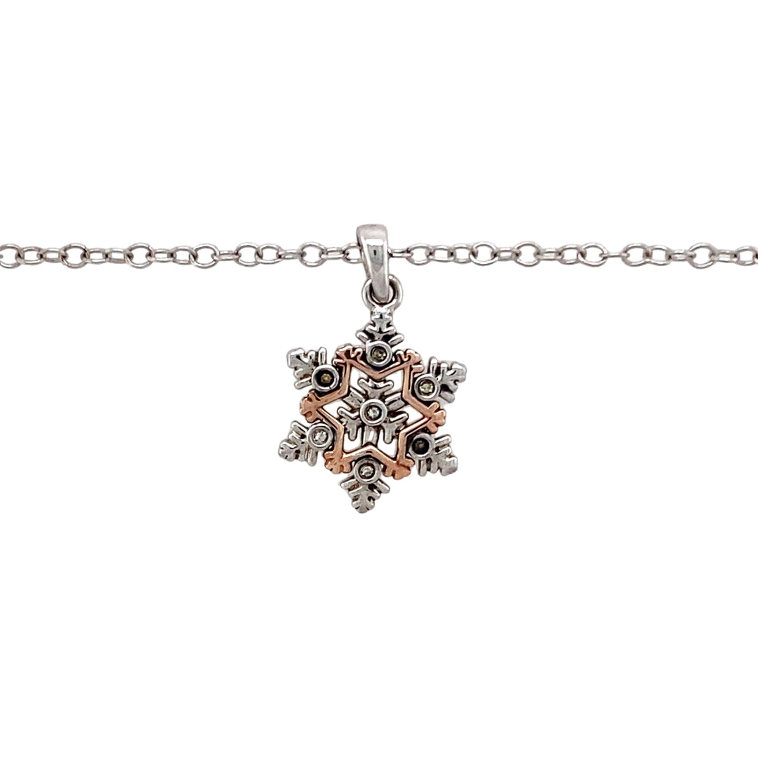 Preowned 925 Silver Clogau with 9ct Rose Gold & Cubic Zirconia Clogau Snowflake Pendant on an 18" - 22" Clogau adjustable curb chain with the weight 3.80 grams. The pendant is 2.2cm long including the bail