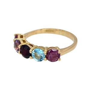 Preowned 18ct Yellow Gold & Gemstone Set Band Ring in size S with the weight 4.40 grams. The gemstones are each 5mm diameter and they are ruby, amethyst, garnet, blue topaz and ruby