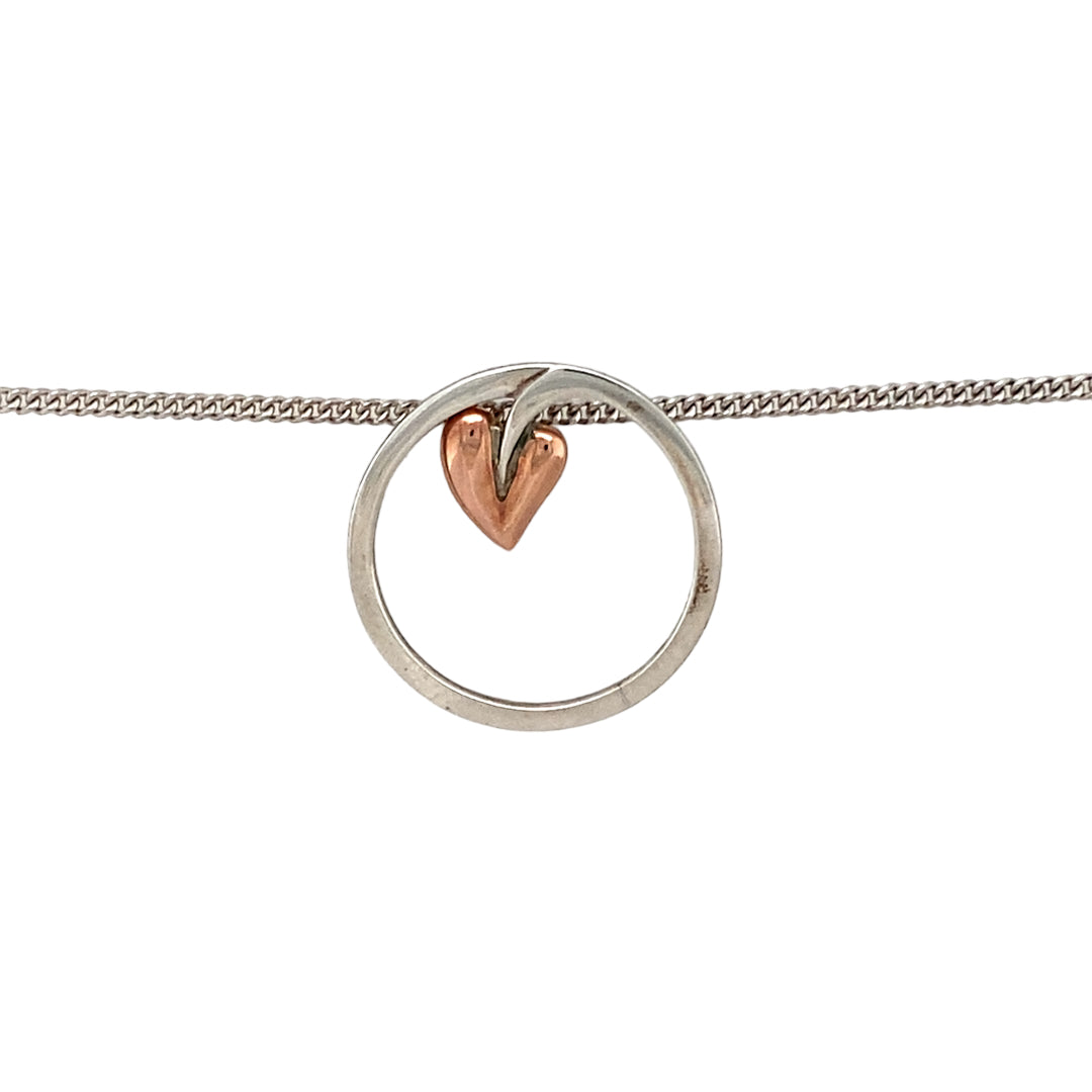 Preowned 925 Silver with 9ct Rose Gold Clogau Tree of Life Circle Pendant on an 18" Clogau silver curb chain with the weight 4.70 grams. The pendant is 2cm diameter