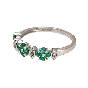 Preowned 9ct White Gold Diamond & Emerald Set Band Ring in size M with the weight 1.60 grams. The band is approximately 5mm wide at the front