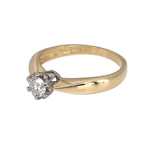 Preowned 9ct Yellow and White Gold & Diamond Set Solitaire Ring in size K with the weight 2.10 grams. The diamond is approximately 20pt with approximate clarity i1