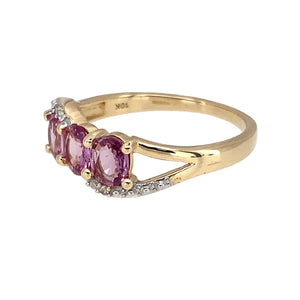 Preowned 9ct Yellow and White Gold Diamond & Pink Sapphire Set Trilogy Ring in size N with the weight 2.20 grams. The sapphire stones are each 5mm by 4mm