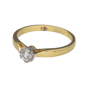Preowned 18ct Yellow and White Gold & Diamond Set Solitaire Ring in size M to N with the weight 2.60 grams. The diamond is approximately 25pt with the approximate clarity Si2 and colour K - M