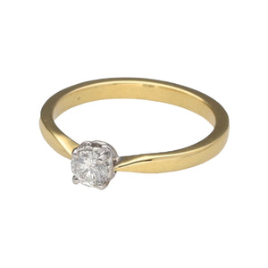 Preowned 18ct Yellow and White Gold & Diamond Set Solitaire Ring in size P with the weight 3.60 grams. The Diamond is approximately 30pt with approximate clarity i1 and colour K - M