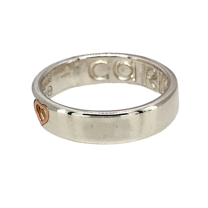 Preowned 925 Silver with 9ct Rose Gold Clogau Cariad Heart 'Take my Heart' Band Ring in size N with the weight 3.80 grams. The band is approximately 5mm wide