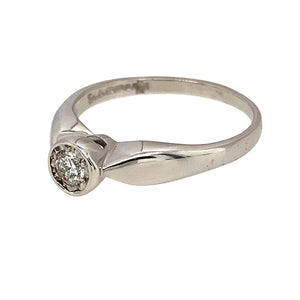 Preowned 9ct White Gold & Diamond Rubover Set Solitaire Ring in size M with the weight 2.30 grams. The diamond is approximately 11pt and is illusion set