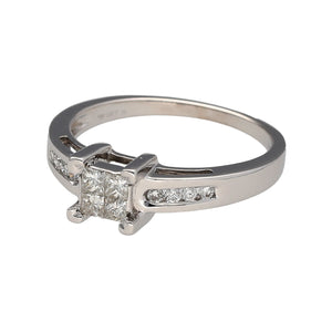 Preowned 18ct White Gold & Diamond Illusion Set Princess Cut Solitaire Ring in size N with the weight 3.60 grams. There is approximately 33pt of diamond content in total