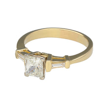 Load image into Gallery viewer, Preowned 14ct Yellow and White Gold &amp; Diamond Set Emerald Cut Solitaire Ring in size V with the weight 6.10 grams. The center Diamond is approximately 1.10ct with a baguette cut Diamond on either side. The Diamonds are approximate clarity VS1 and colour N - R
