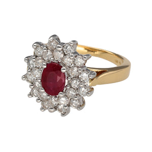 Preowned 18ct Yellow and White Gold Diamond & Ruby Set Cluster Ring in size L to M with the weight 7.30 grams. The ruby stone is 7mm by 5mm and there is approximately 96pt of diamond content in total