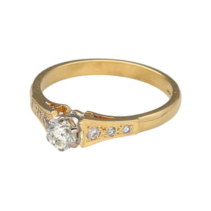 Preowned 18ct Yellow Gold & Diamond Set Solitaire Ring with diamond set shoulders. The ring is in size N with the weight 3.10 grams. There is approximately 28pt - 31pt of diamond content in total at approximate clarity Si and colour K - M