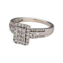 Load image into Gallery viewer, Preowned 9ct White Gold &amp; Diamond Halo Cluster Ring with diamond set shoulders. The ring is in size O with the weight 3.20 grams. There is approximately 50pt of diamond content set in total made up of six princess cut diamonds set in a rectangle surrounded by a halo of brilliant cut diamonds. The diamond are approximate clarity i1 and colour K - M
