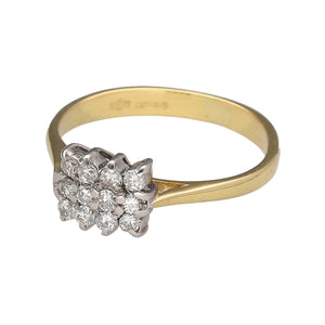 Preowned 18ct Yellow and White Gold & Diamond Cluster Ring in size L with the weight 2.60 grams. There is approximately 36pt of diamond content set in the ring