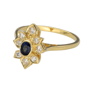 Preowned 18ct Yellow Gold Diamond & Sapphire Set Cluster Flower Ring in size O with the weight 4 grams. The sapphire stone is 4mm by 3mm and the front of the ring is 14mm high