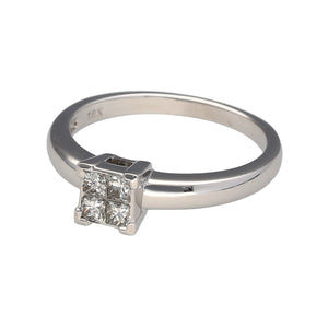 Preowned 18ct White Gold & Diamond Illusion Solitaire Ring in size K with the weight 3 grams. The four princess cut diamonds are set together to give the illusion on a bigger stone and there is approximately 20pt of diamond content in total