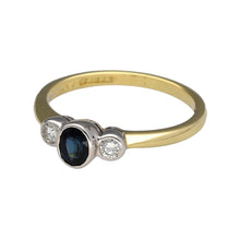Load image into Gallery viewer, Preowned 18ct Yellow and White Gold Diamond &amp; Sapphire Set Trilogy Ring in size N with the weight 3.10 grams. The sapphire stone is 5mm by 4mm
