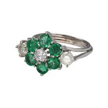 Load image into Gallery viewer, Preowned 18ct White Gold Diamond &amp; Emerald Set Flower Cluster Ring in size N with the weight 6.60 grams. There are three diamond at approximately 25pt each so there is a total of approximately 75pt of diamond content in total. There are six emerald stones at approximately 4mm diameter each
