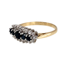 Load image into Gallery viewer, Preowned 9ct Yellow and White Gold Diamond &amp; Sapphire Set Cluster Band Ring in size N with the weight 2.70 grams. The center sapphire stone is 4mm diameter and the go down in size as they graduate out. There is approximately 20pt of diamond content set in total
