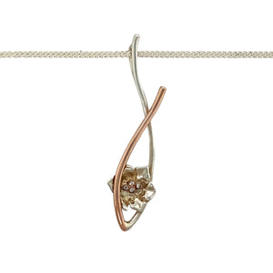 Preowned 925 Silver Clogau with 9ct Rose Gold & Diamond Set Clogau Daffodil Pendant on an 18" Clogau curb chain with the weight 5.10 grams. The pendant is 4.3cm long