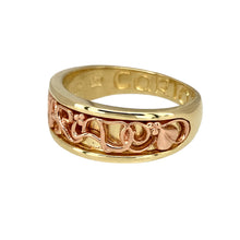 Load image into Gallery viewer, Bring heartfelt meaning and elegant design to your collection with this pre-owned 9ct yellow and rose gold Clogau Cariad band ring, symbolising love and affection—perfect for marking special moments with timeless Welsh heritage.

Design: The front of the band measures 7mm wide and features the word Cariad (Welsh for &quot;beloved&quot;) engraved in a flowing script, framed by softly polished edges and subtle rose gold detailing for a warm, meaningful contrast.

