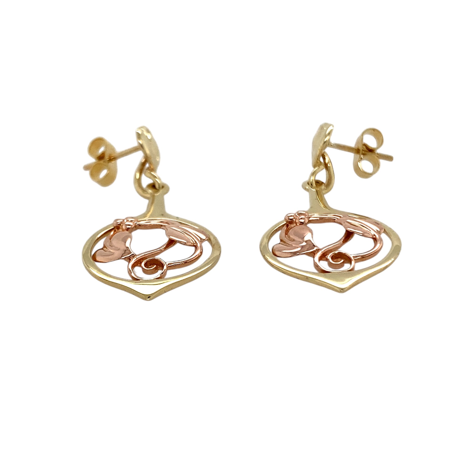 Bring symbolic beauty and graceful detail to your collection with these pre-owned 9ct yellow and rose gold Clogau Tree of Life drop earrings—a meaningful design inspired by nature and connection.

Design: Each earring features the iconic Tree of Life motif, combining flowing vines and leaves in a delicate openwork drop style.
Material: Made from 9-carat yellow and rose gold, the contrasting tones highlight the intricate design and signature Clogau detail.
