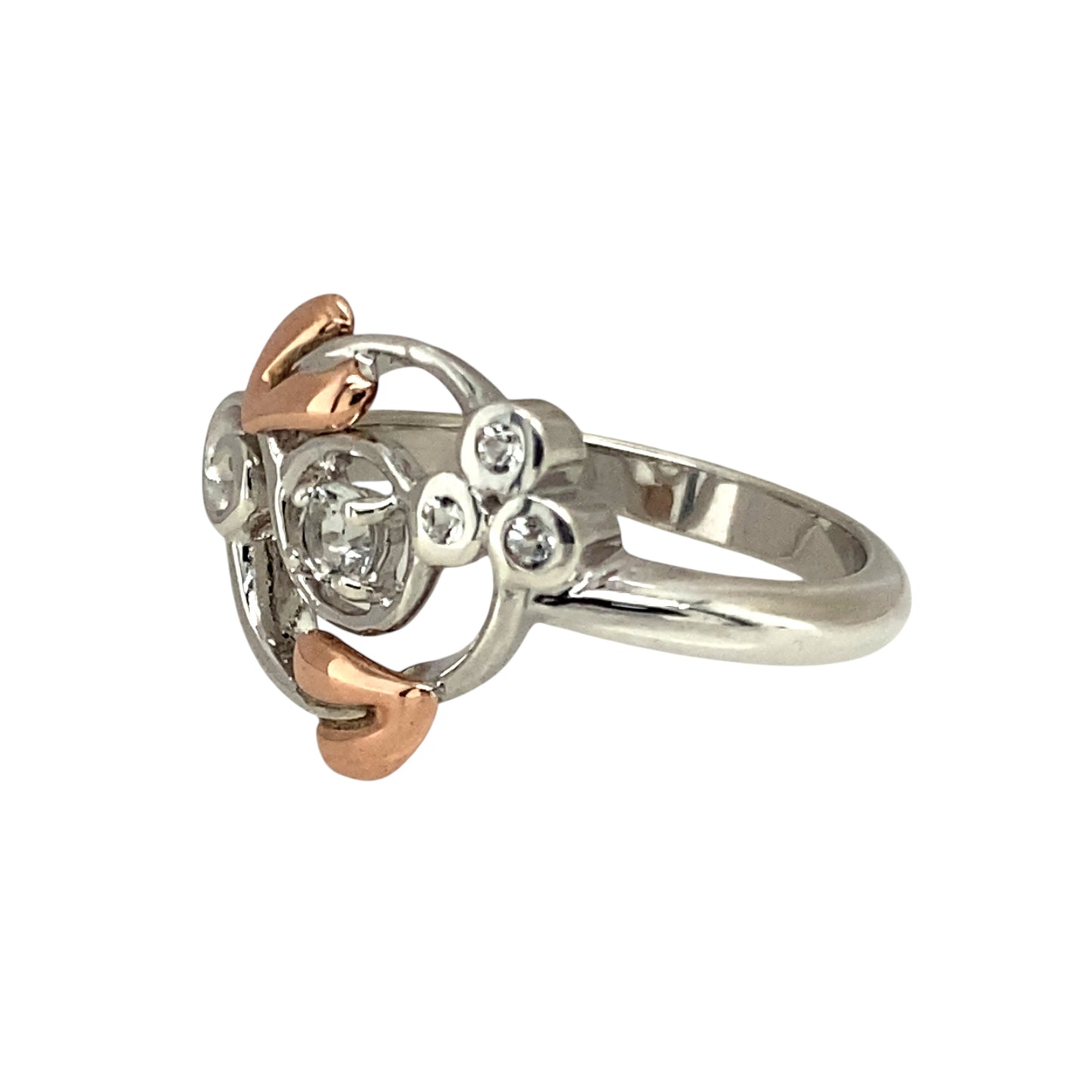 Elegant and symbolic, this pre-owned Clogau Tree of Life ring blends sterling silver, 9ct rose gold, and sparkling white topaz—perfect for meaningful style with a refined finish.

Design: The ring features a 3mm round white topaz stone at the centre, framed by a flowing Tree of Life design in 925 silver with delicate 9ct rose gold detailing.
Material: Made from sterling silver and 9-carat rose gold, the polished finish highlights the soft contrast between metals and the brilliance of the topaz.
