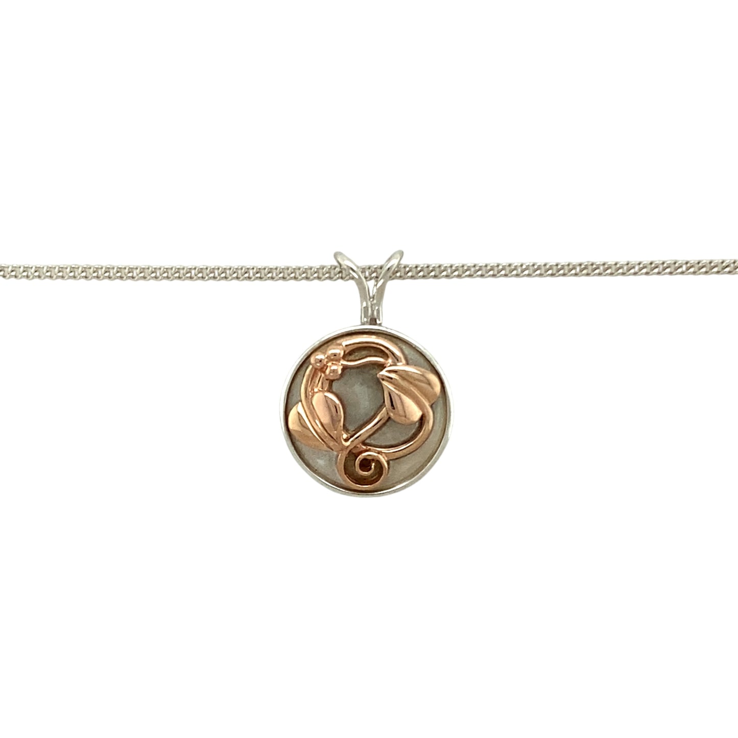 Preowned 925 Silver with 9ct Rose Gold Clogau Tree of Life Round Pendant on an 18" Clogau curb chain with the weight 5.90 grams. The pendant is 2.3cm long including the bail