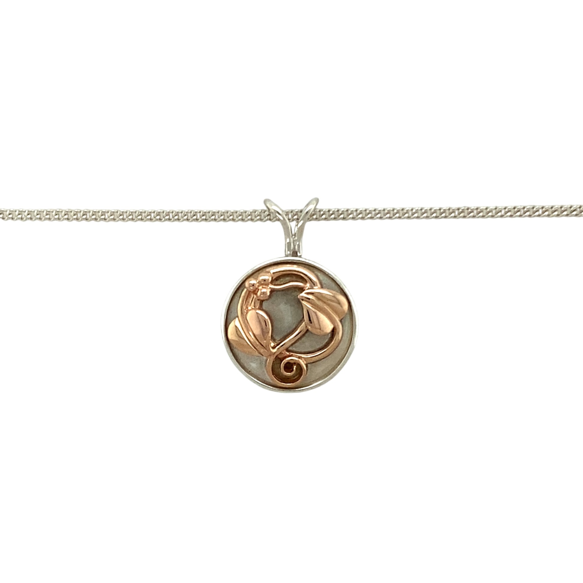 Preowned 925 Silver with 9ct Rose Gold Clogau Tree of Life Round Pendant on an 18" Clogau curb chain with the weight 5.90 grams. The pendant is 2.3cm long including the bail