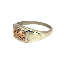 Load image into Gallery viewer, Bring proud heritage and bold design to your jewellery collection with this pre-owned 925 silver Clogau Welsh Dragon signet ring, detailed with 9ct rose gold—perfect for showing national pride in a timeless style.

Design: The ring features an 8mm high oval front engraved with the iconic Welsh Dragon, highlighted in polished 9ct rose gold for a striking and recognisable look.

