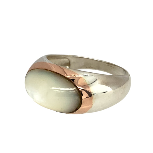 Preowned 925 Silver Clogau with 9ct Rose Gold & Mother of Pearl Set Clogau Ring in size R with the weight 5.60 grams. The mother of pearl stone is 16mm by 10mm