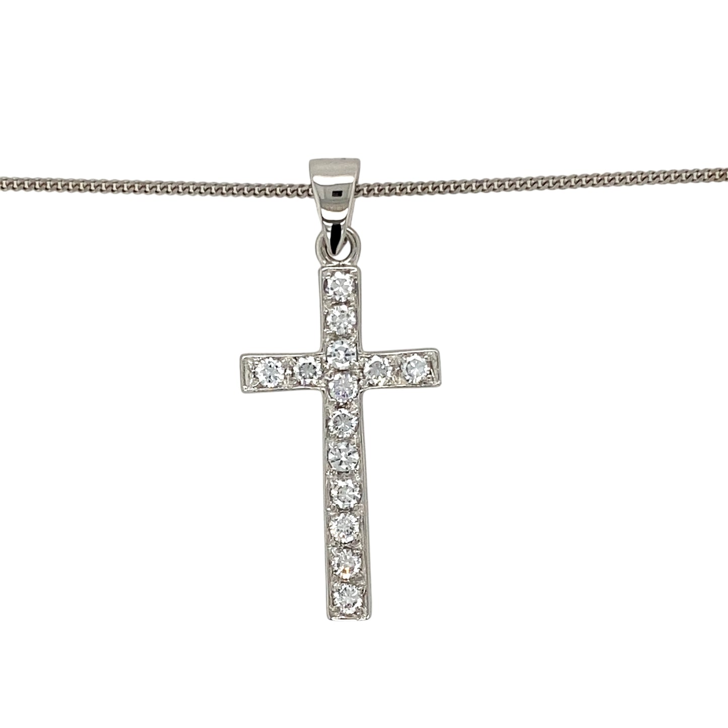 Add a touch of elegance and faith to your jewellery collection with this pre-owned 9ct white gold &amp; cubic zirconia set cross pendant necklace, featuring:

Design: A classic cross pendant, adorned with sparkling cubic zirconia for a refined and meaningful look.
Material: 9-carat white gold, offering a sleek and timeless appeal.
Gemstones: Set with cubic zirconia, adding brilliance and elegance.
Size &amp; Weight: The pendant measures 4cm long including the bail, with a solid weight of 7.30 grams