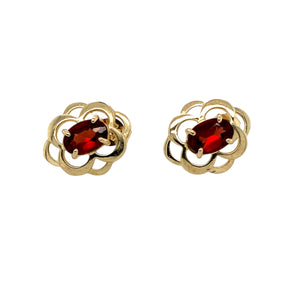 Add a touch of vintage charm to your jewellery collection with these pre-owned 9ct yellow gold & garnet set flower style stud earrings, featuring:

Design: Elegant flower-style stud earrings, showcasing a timeless and feminine floral-inspired design.
Material: 9-carat yellow gold, offering a warm and classic appeal.
Gemstones: Each earring is set with a 6mm by 4mm garnet, known for its deep red hue and timeless beauty.
Weight: A lightweight yet durable 1.40 grams, ensuring comfortable everyday wear.
