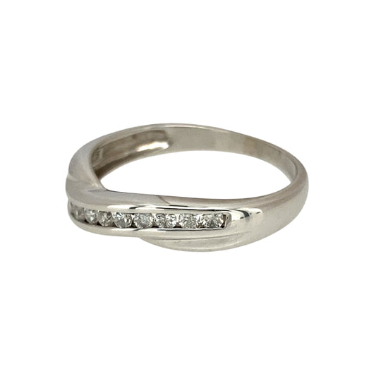 Add a touch of modern elegance to your jewellery collection with this pre-owned 9ct white gold & diamond set crossover band ring, featuring:

Design: A stylish crossover band, offering a contemporary and sophisticated look.
Material: Crafted in 9-carat white gold, providing a sleek and polished finish.
Gemstone Detail: Accented with sparkling diamonds, adding brilliance and refinement.
Ring Width: Measures 3mm wide in the middle and 5mm wide on the sides, creating a dynamic and eye-catching design.
