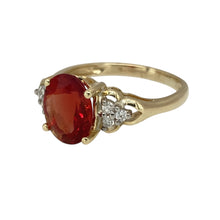 Load image into Gallery viewer, Add a bold and elegant touch to your jewellery collection with this pre-owned 9ct yellow gold diamond &amp; red stone set ring, featuring:

Design: A timeless and sophisticated ring, showcasing a striking central gemstone.
Material: 9-carat yellow gold, offering a warm and polished finish.
Gemstone Arrangement: Features a vibrant 10mm by 8mm red-coloured stone, creating a bold and eye-catching look.
Diamond Accents: Sparkling diamonds enhance the ring’s elegance with added brilliance.

