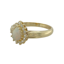 Load image into Gallery viewer, Add a touch of elegance and shimmer to your jewellery collection with this pre-owned 9ct yellow gold diamond &amp; opalique teardrop set cluster ring.

Design: A stunning cluster design featuring a teardrop-shaped opalique stone, beautifully framed by sparkling diamonds for added brilliance.
Material: Made from 9-carat yellow gold, providing a warm and polished finish that enhances the beauty of the gemstones.
Gemstone Detail: The opalique stone measures 7mm by 5mm, displaying captivating iridescent hues
