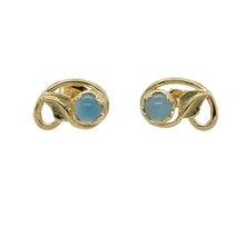 Load image into Gallery viewer, Add a touch of natural charm and colour to your jewellery collection with these pre-owned 9ct yellow gold leaf stud earrings, featuring:

Design: A delicate leaf-inspired design with a vibrant blue stone at the centre, blending botanical elegance with a pop of colour.
Material: 9-carat yellow gold, offering a warm, polished finish that beautifully complements the vivid stones.
Gemstone Detail: Each earring is set with a 5mm diameter blue stone, adding eye-catching sparkle and contrast.

