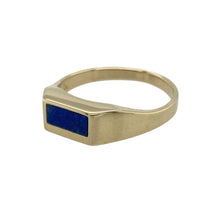 Load image into Gallery viewer, Add a refined pop of colour to your collection with this pre-owned 9ct yellow gold blue stone set signet ring, combining traditional form with a sleek, modern twist, featuring:

Design: A classic signet ring design with a sleek rectangular blue stone set into the centre, offering a bold yet elegant focal point with clean lines and timeless appeal.
Material: Made from 9-carat yellow gold, the polished finish enhances the rich tone of the gold and provides a warm contrast to the vibrant blue stone.
