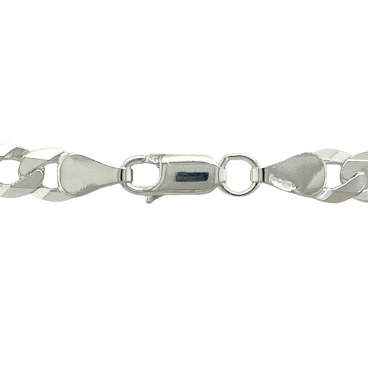 Add strong, timeless style to your collection with this pre-owned 925 silver 22" curb chain, offering bold presence and everyday versatility:

Design: A traditional curb link chain featuring flat, interlocking links for a sleek and flexible drape, creating a clean and polished look perfect for layering or wearing alone.
Material: Crafted from 925 sterling silver, the chain is finished with a bright polish that enhances its classic and enduring appeal.