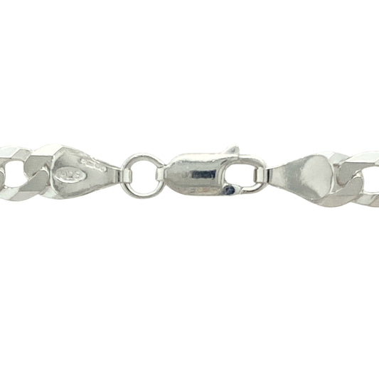 Elevate your style with this new 925 silver 25" curb chain, offering a bold yet classic look with extra length for versatile wear:

Design: A traditional curb link chain featuring flat, closely interlocking links, providing a smooth and flexible drape with a sleek, timeless appearance.
Material: Crafted from solid 925 sterling silver, the chain boasts a bright, polished finish that enhances its clean lines and enduring appeal.