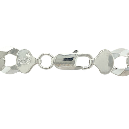 Make an unmistakable statement with this new 925 silver 26" curb chain, combining substantial weight with timeless design for a strong, confident look:

Design: A traditional curb link chain with wide, flat interlocking links, offering a sleek, polished drape and a bold, commanding appearance.
Material: Crafted from solid 925 sterling silver, the chain features a bright, polished finish that enhances its clean, powerful lines.
Dimensions: Measuring 26 inches in length with a robust 10mm link width